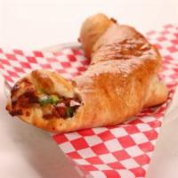 Sausage Roll · Italian sausage, green peppers, and red onions.