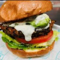 Against The Grain Veggie Burger  · Black beans, brown rice, carrots, herbs, flax, avocado, lettuce, tomato, onion, vegan ranch,...