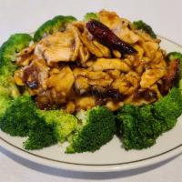 Orange Chicken · Hunan style. Sliced chicken sauteed with orange skin in delicious spicy brown sauce. Broccol...