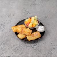 Cheese Blintzes · 4 blitzes serves with sour cream and fruit salad.