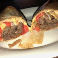 Steak Wrap · Chef Joe's butter steak, sauteed onions, roasted red peppers and cheddar cheese. Includes ch...