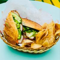 Spicy Crispy Chicken Baguette Sandwich · Spicy Crispy Chicken, Pickled daikon, carrot, cucumber, jalapeno and cilantro on a French ba...