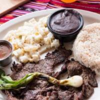 Carne Asada · Con arroz, frijoles fritos, ensalada, chirmol, cebollin y 3 tortillas. Steak served with ric...