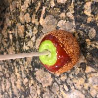 Chile Limon Candy Apple · Granny Smith apple dipped in candy and rolled in tajin. Chamoy sauce is optional on side.