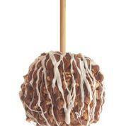 Pecan Bear Caramel Apple · Granny Smith apple dipped in caramel, rolled in pecans and drizzled with milk and white choc...