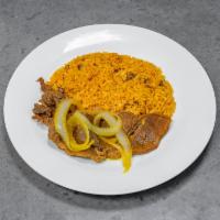 Steak and Onions (Bistec Y Cebolla) · Served with arroz con gondolas or white rice and beans.