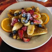 Crunchy French Toast · Dipped in our crunchy batter and grilled golden brown, served with caramelized bananas and f...