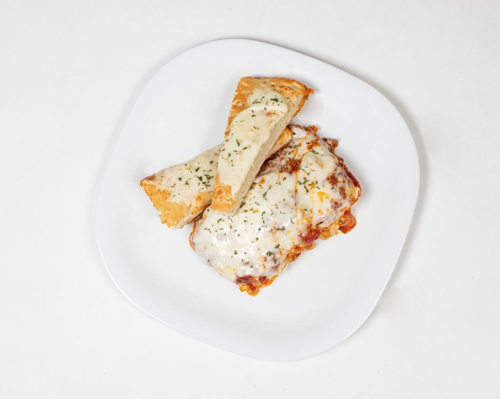 Lasagna · Served with ground beef, ricotta, mozzarella and Parmesan cheese.