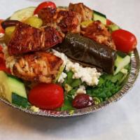 Small Greek Salad with Chicken · Fresh mixture of romaine and iceberg lettuce topped with Kalamata olives, pepperoncini, feta...