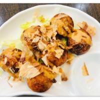Takoyaki ·  6 pieces. Eel sauce, ball shape filled with diced octopus, topped with scallion, mayo bonit...