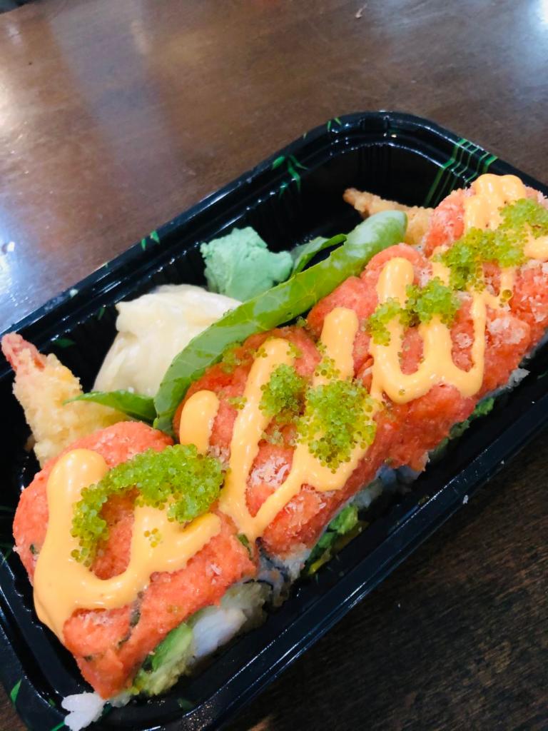 Angel roll · Shrimp tempura, mango avocado inside topped with spicy tuna ,green tobiko and chef’s special sauce 