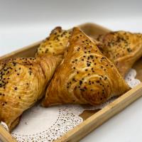 Samsa (lamb) · Lamb, aromatic spices mixed with onions and stuffed in a crispy pastry