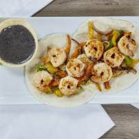 Tacos al Gobernador · 2 grilled shrimp tacos, bell peppers on flour tortilla, fresh homemade guacamole and flour s...