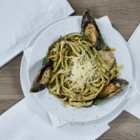 Pasta al Pesto · Fettuccine pasta, fresh made pesto sauce with grilled shrimp, octopus, mussels and clam call...