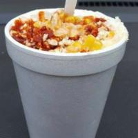 Elotes  · Corn in a cup with mayonnaise, cheese, butter, spicy chili powder.