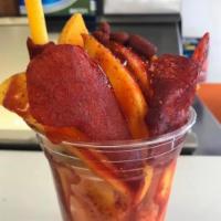 Mango Preparado · Cut up fresh mango with chamoy, tajin and lime with spicy mango candy.