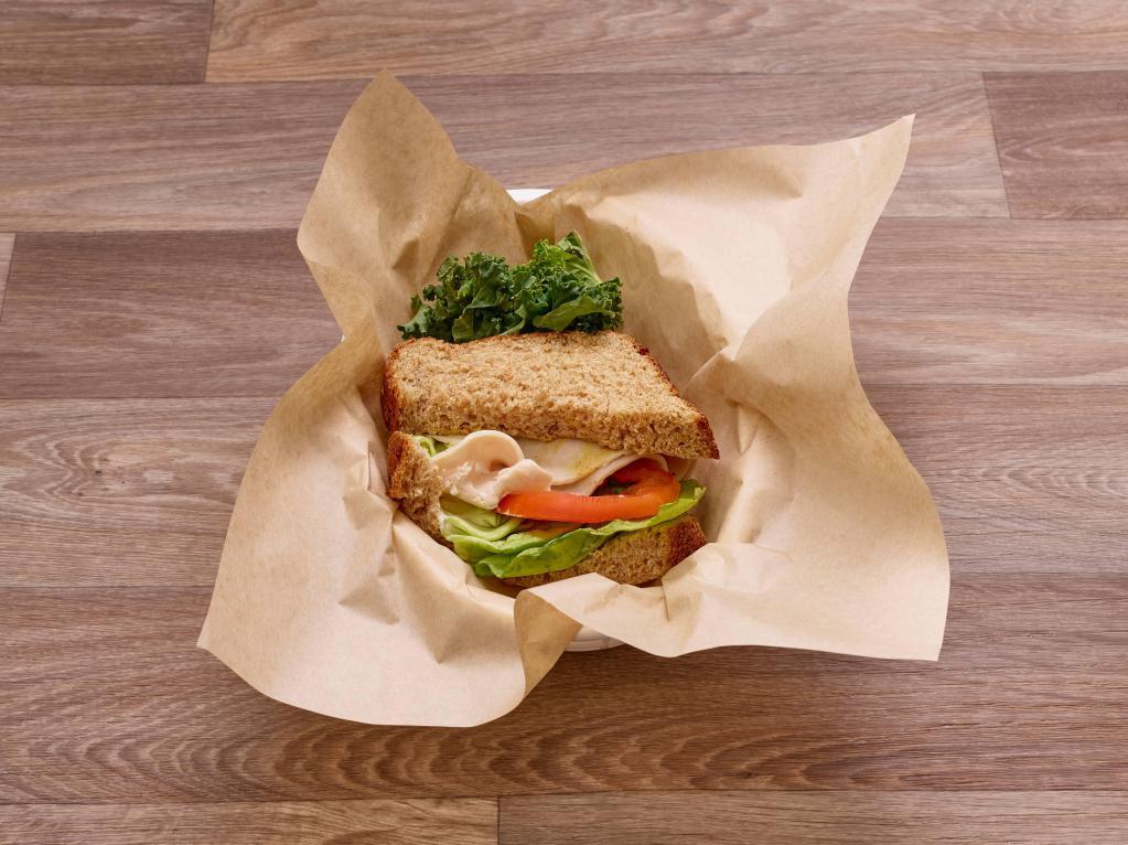 Smoked Turkey Classic Sandwich · Served with mayonnaise, mustard, lettuce and tomato.