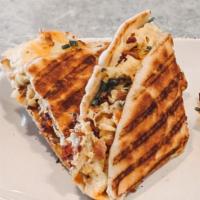 Crisp Bacon and Cheddar Cheese Panini  · A toasted sandwich often served on Italian bread. 