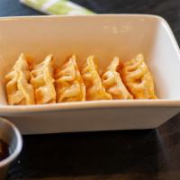 F-1. Gyoza 12 pcs_Fried Dumplings (튀김만두/油炸饺子) · Deep-fried dumplings with cabbage salad. Served 12 pieces.