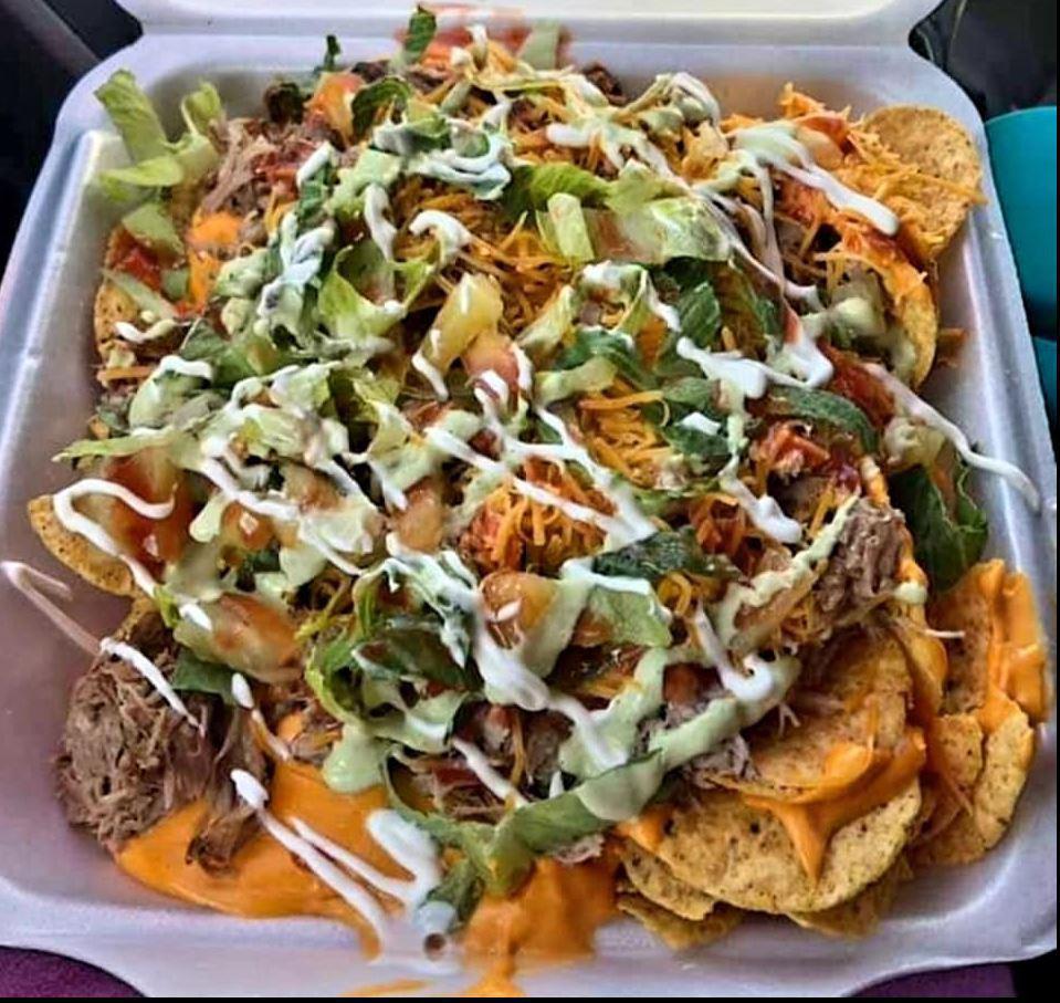 Colten's Carnita's Nachos · Slow-cooked marinated pork butt, onion, cilantro, pineapple, sissy sauce, lime, cheese, and lettuce. Served over a bed of chips. Authentic with a Southern twist.