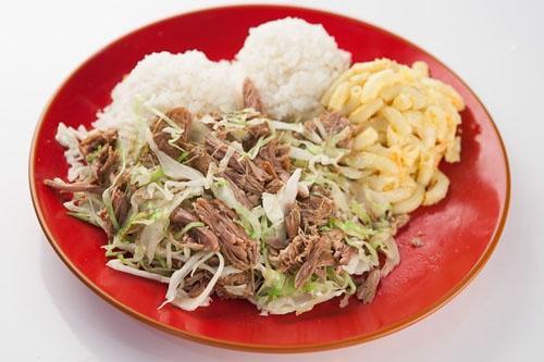 E2. Kalua Pork with Cabbage Mini · Smoke-flavored, succulent shredded pork slowly roasted to a flavorful finish and mixed with cabbage.