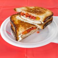 Big Mama Specialty Sandwich · Chicken cutlet, fresh mozzarella, roasted red peppers, balsamic, and oil.