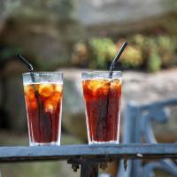 Iced Americano · Espresso and hot water on ice 
