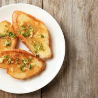 Garlic Bread with Mozzarella Cheese · Oven-baked bread topped with garlic and melted cheese.