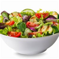 Dinner Salad · Classic style salad with fresh lettuce, olives, tomatoes and mushrooms.