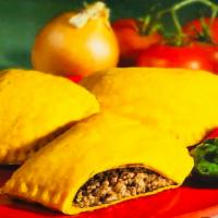 Jamaican Beef Patty · Jamaican beef patties are made with a rich flaky yellow pastry dough filled with seasoned gr...