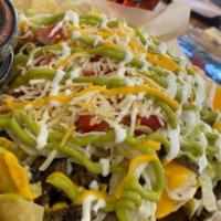 Big Cheesy Nachos · Nacho cheese sauce over fresh chips topped with your choice of meat and your choice of toppi...