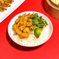 Panang Curry · Tender chicken, snow peas, and red bell peppers simmered in a traditional Thai curry made wi...