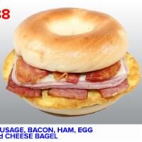  B08. Sausage, Bacon, Ham, Egg, and Cheese Bagel · Boiled and baked round bread roll with sausage, bacon, egg and cheese.
