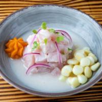 Tradicional Ceviche · Marinated lightly in lime juice and seasoned with Peruvian limo chili, fresh cilantro, and o...