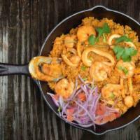 Arroz con Mariscos · Our best seafood combination of shrimp, squid and scallops, all mixed with rice, red pepper,...