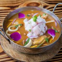 Parihuela Acevichada · Seafood and corvina soup with Peruvian panca pepper, garnished with fish ceviche.