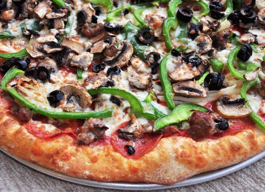 Supremo Pizza · Tomato sauce, mozzarella cheese, pepperoni, fresh mushrooms, green peppers, caramelized onions, Italian sausage and black olives.