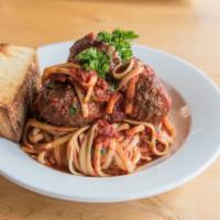 Spaghetti and Meatballs · Spicy handmade meatballs served with marinara sauce over pasta. Served with a slice of garli...