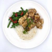 Orange Ginger Chicken · Seared and diced  all natural chicken breast tossed in our orange ginger sauce over long gra...