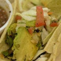 Grilled Avocado · Grilled avocado slices topped with shredded cabbage, pico de gallo and lime.