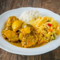 Curry Chicken · Served with white rice or rice and peas with steamed veggies or salad and sweet plantains 