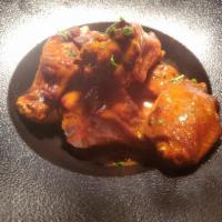 Jumbo Buffalo Wings · Homemade Cajun-Style Hot Sauce & Your Choice of Dipping Sauce