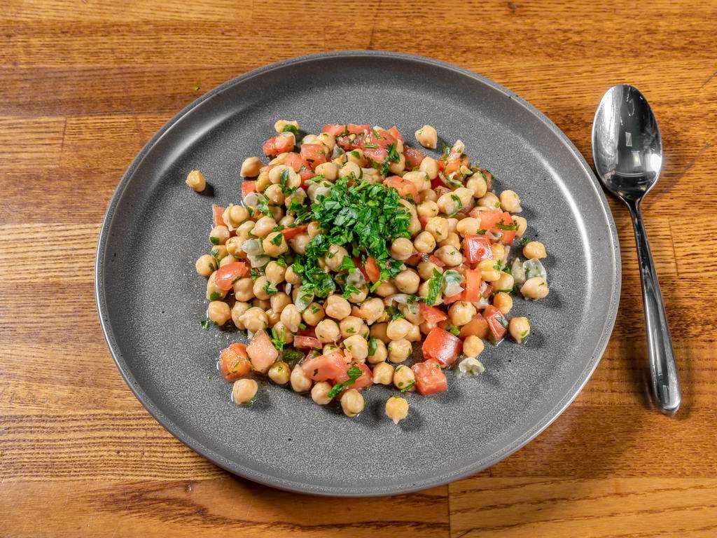 Chickpea Salad · Pre-packaged. Fresh Chickpeas mixed with Italian Parsley, Fresh Tomatoes, Fresh Lemon Juice, Organic Extra Virgin Olive Oil