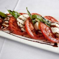Insalata Caprese · Fresh mozzarella, tomatoes and fresh basil drizzled with extra virgin olive oil and balsamic...