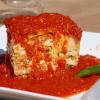 Homemade Lasagna · Wide pasta noodles with layers of imported ricotta, mozzarella, ground beef, veal and pork, ...