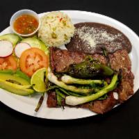 Carne Asada · 8 oz. Skirt steak, jalapeno, and grilled green onions. Rice, beans, and salad. 