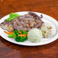 Rib Eye Steak · Served with mashed potatoes and steamed broccoli. 