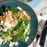 Kale salad · baby kale leaves tossed with avocado, cucumber, feta cheese & almonds served with a champagn...