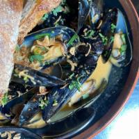 Mussels · steamed mussels in a red curry broth with coconut milk, cilantro and crispy shallots