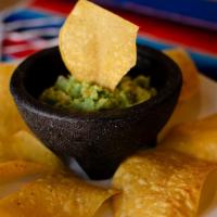 Guacamole Dip · A good portion of fresh guacamole and chips.